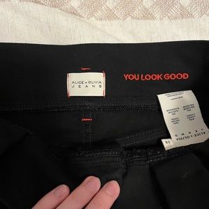 Alice + Olivia High Rise, raw hem black skinny jeans. Excellent used condition